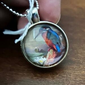 FISHER BIRD PENDANT NECKLACE, HANDMADE, GLASS DOME ON METAL, 23 INCH SILVER-TON
